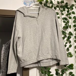 Im selling this grey half zip up. It has a hood and only been worn 2x.